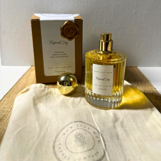 Non-toxic eau de parfum with Tropical Joy glass bottle, gold cap, and cardboard box