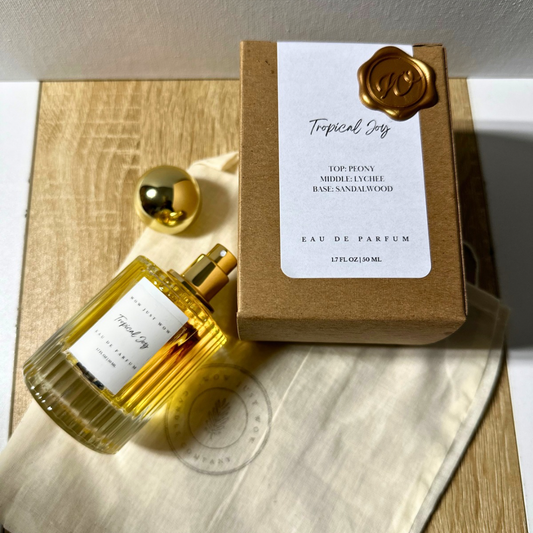 Non-toxic eau de parfum set with Tropical Joy gold bottle, box, and gift label