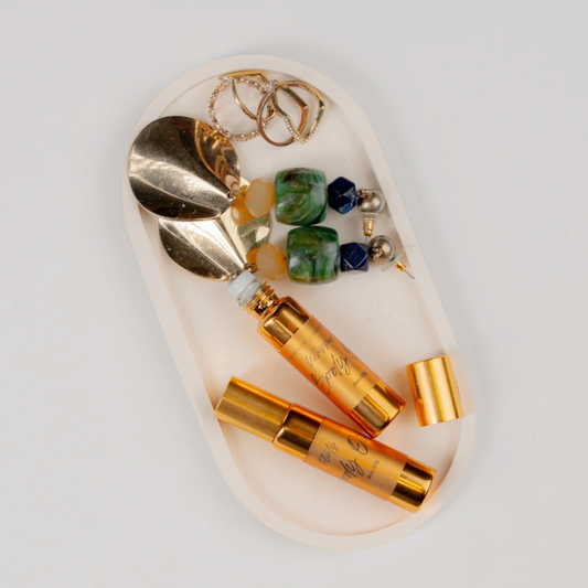 Roll-on body oil perfume set with gold and amber bottles and roller tops