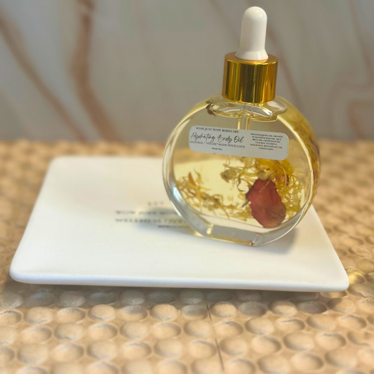 Glass bottle with dropper on a white plate against a neutral background