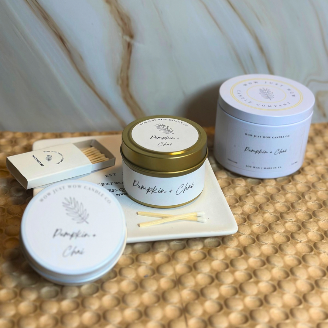 Assorted Pumpkin + Chai soy candle tins in blue and gold with matchbox and matches.