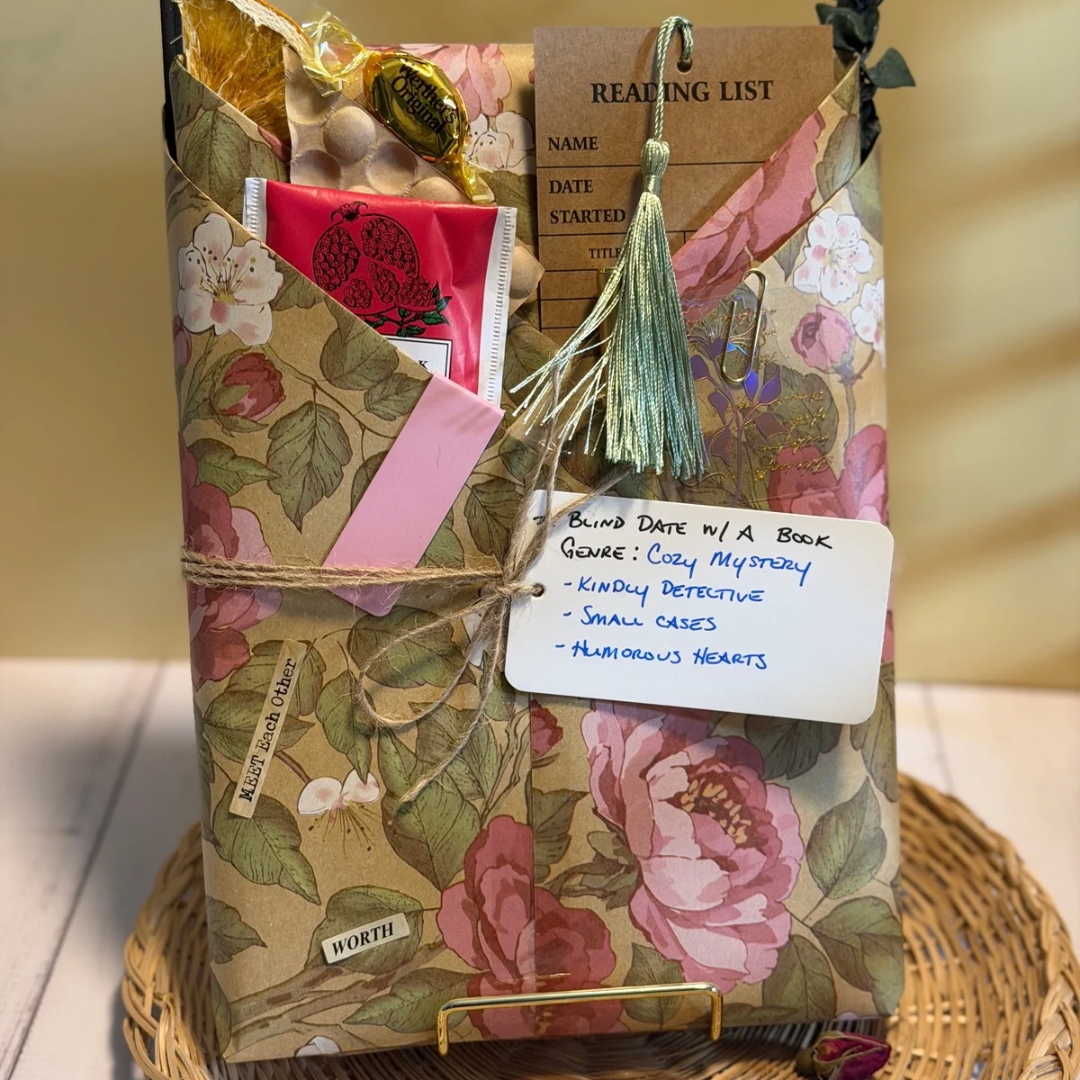 Floral-patterned book with a tag on a woven surface